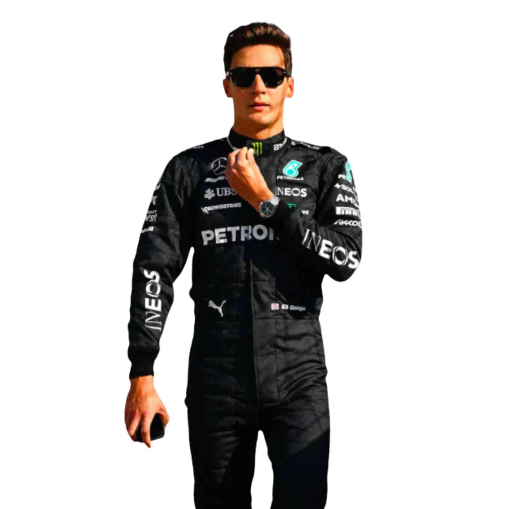 Person wearing a black racing suit with various sponsor logos on a white background