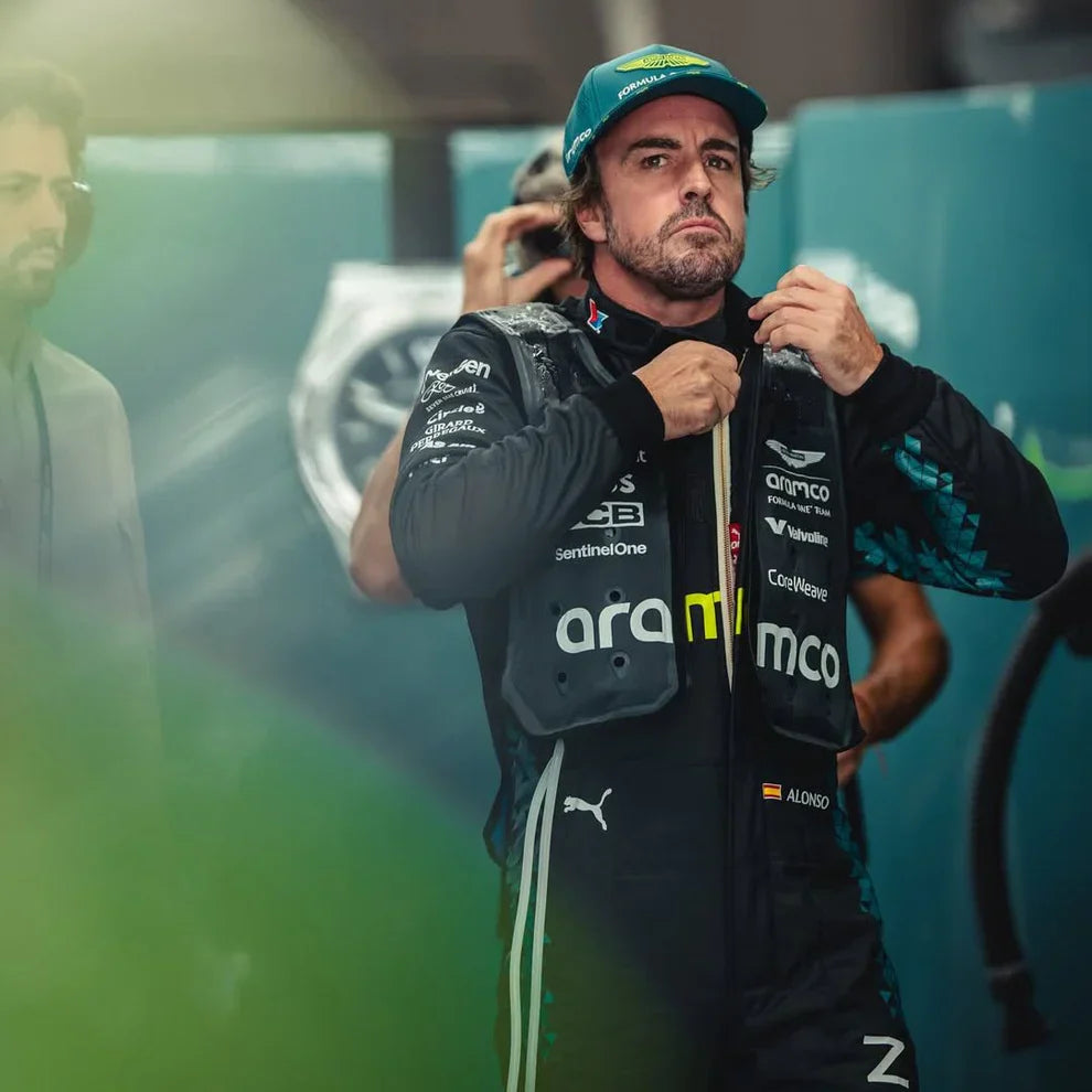Person wearing a branded jacket and cap in a blurred indoor setting