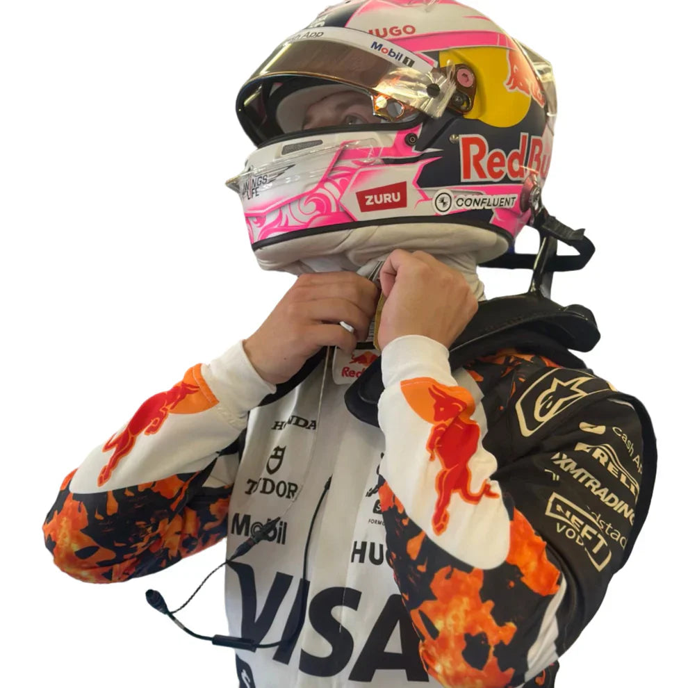 Person wearing a colorful racing suit and helmet with various sponsor logos on a white background