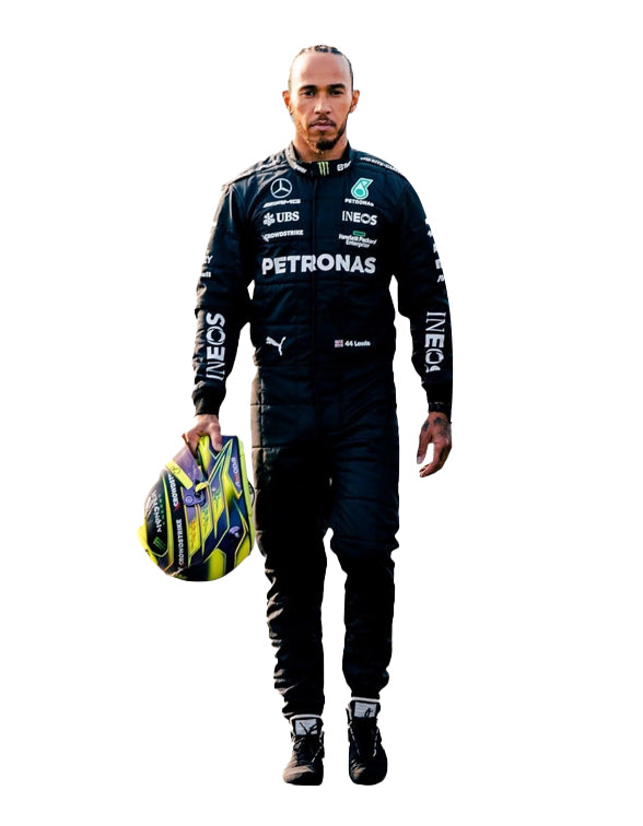 Person wearing a racing suit with various sponsor logos, holding a helmet.