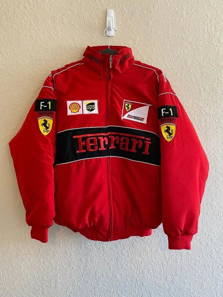 Red Ferrari jacket with various logos on a white wall